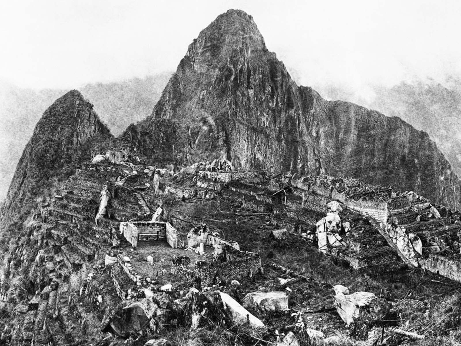 The ruins of Machu Picchu are shrouded in jungle growth in this 1911 photograph captured during the initial visit of Yale archaeologist Hiram Bingham to the site.