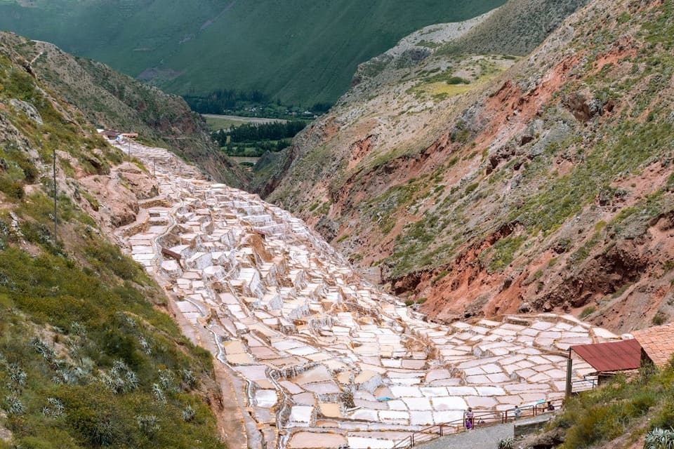 A panoramic view of the terraced salt mines in Urubamba | Peruvian Sunrise