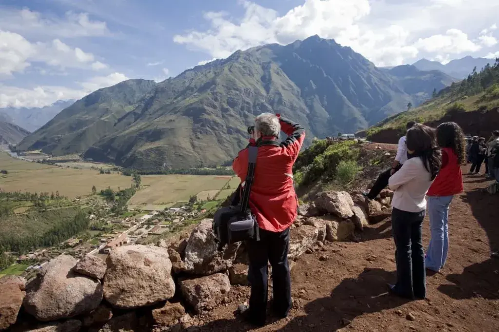 Sweeping view of the Sacred Valley hike with mountains and ancient terraces near Cusco | Peruvian Sunrise